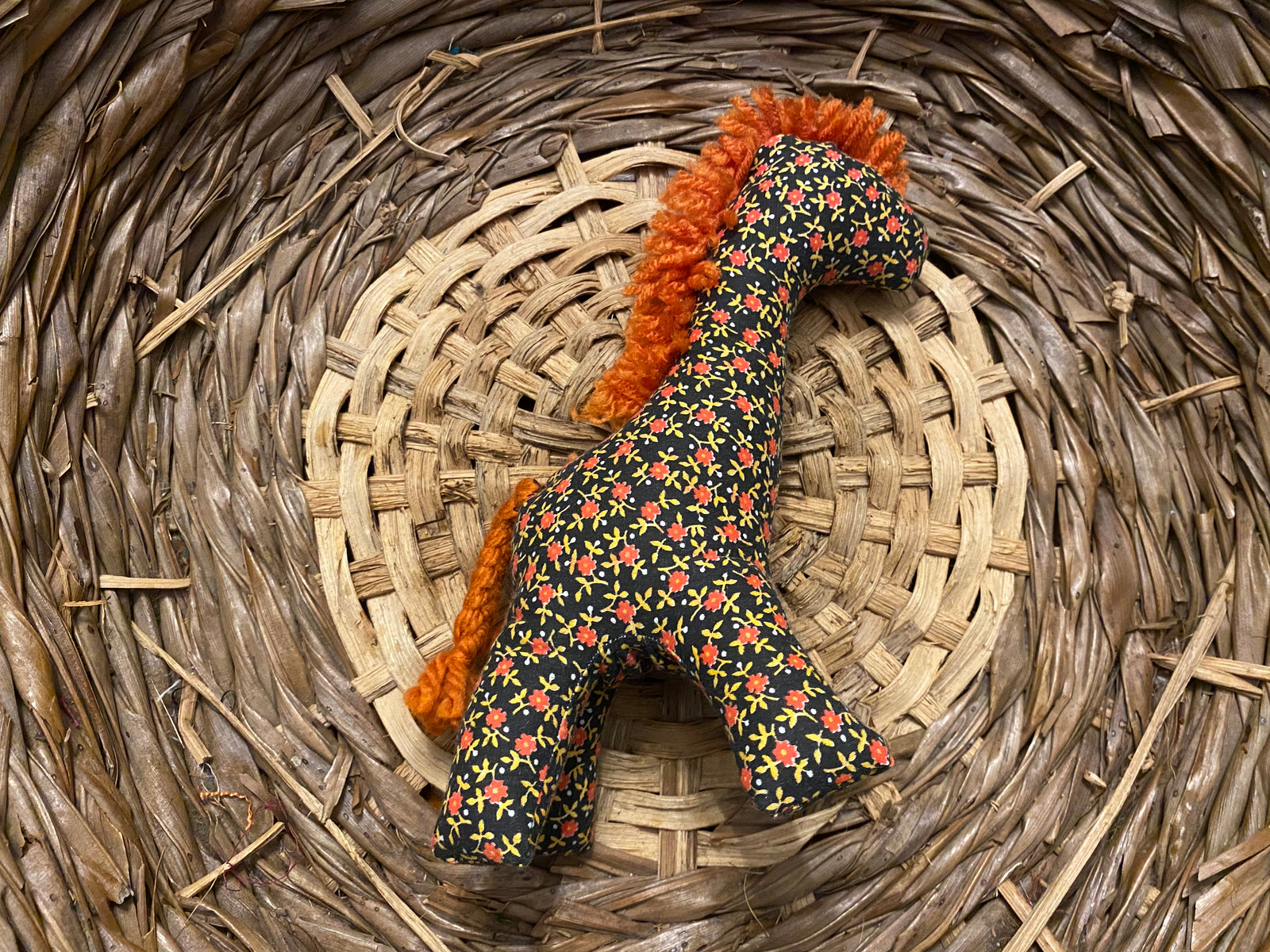 Giraffe black with red flowers