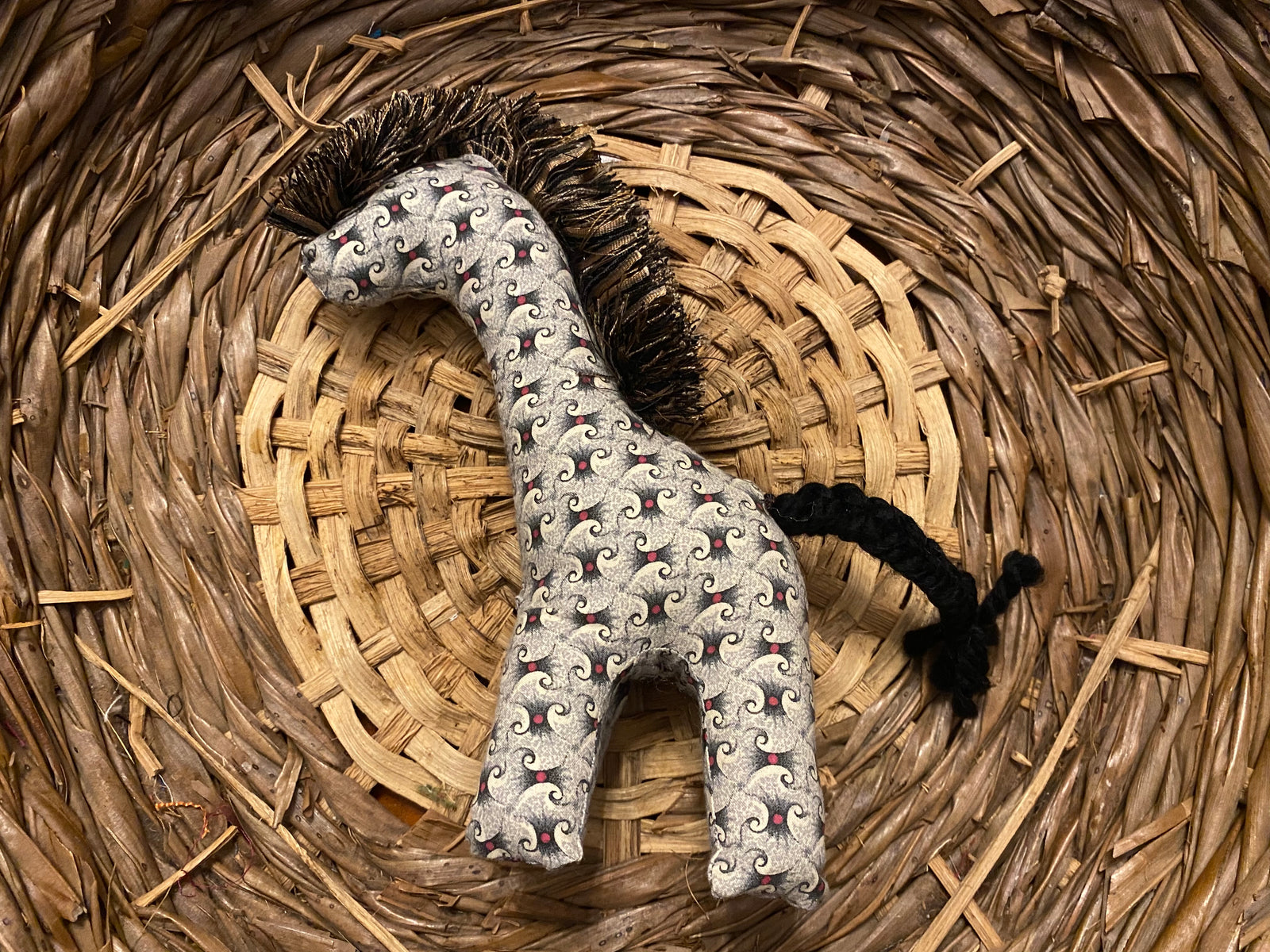 Giraffe gray with black and red pattern