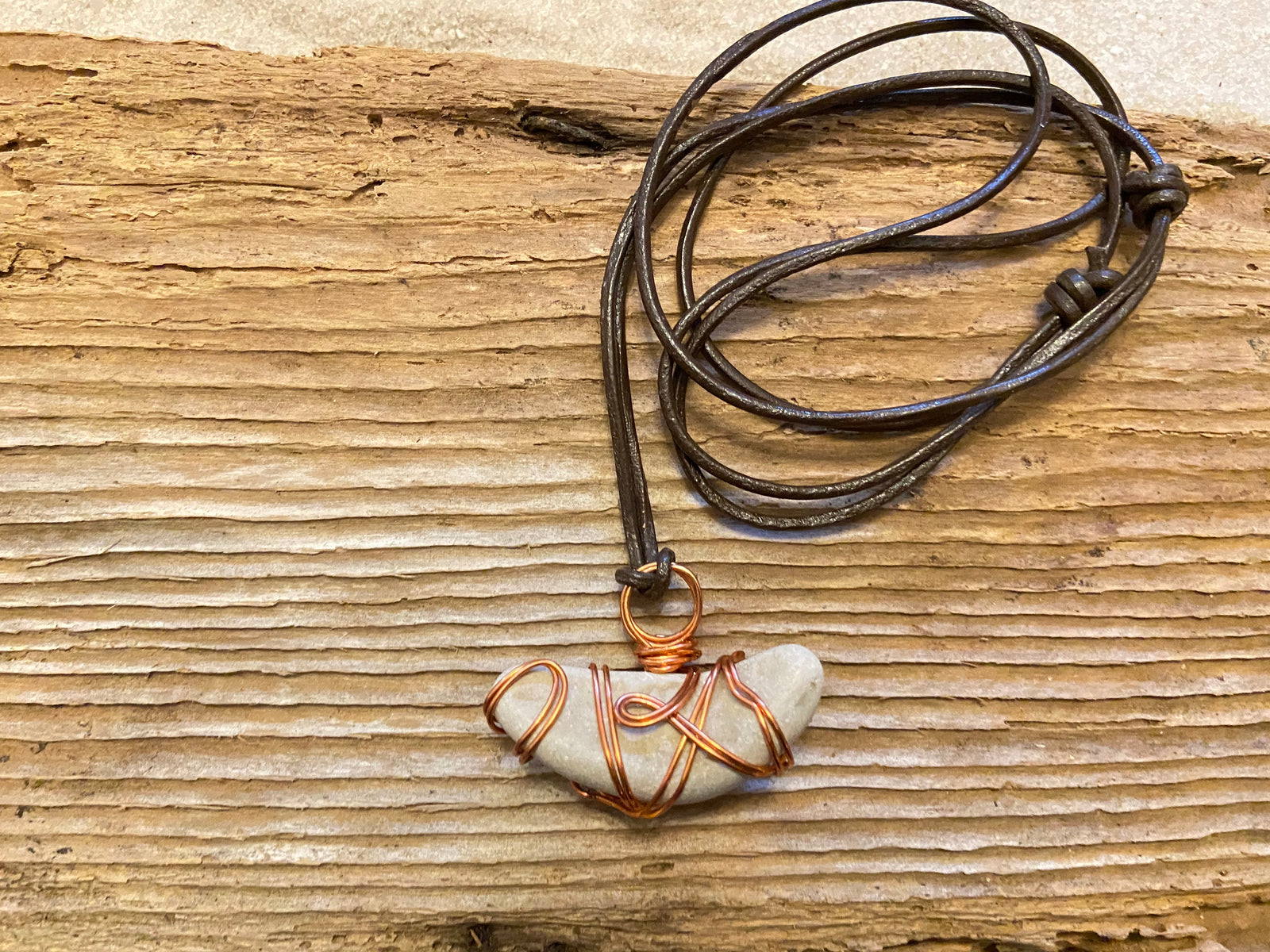 B. Light Necklace- Copper Wire Wrapped Stone on Adjustable Leather Cord