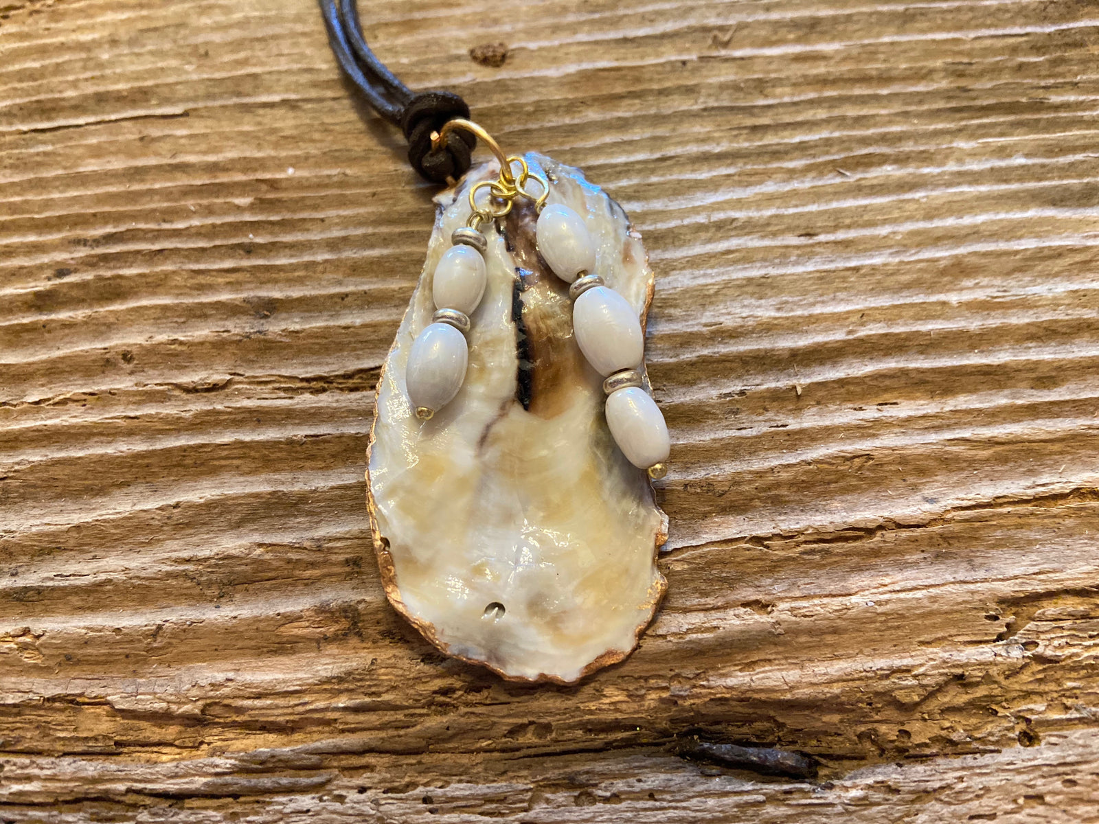 B. Light Necklace - Oyster Shell With Gold Leaf and Pearl Glass Beads on Brown Leather Cording