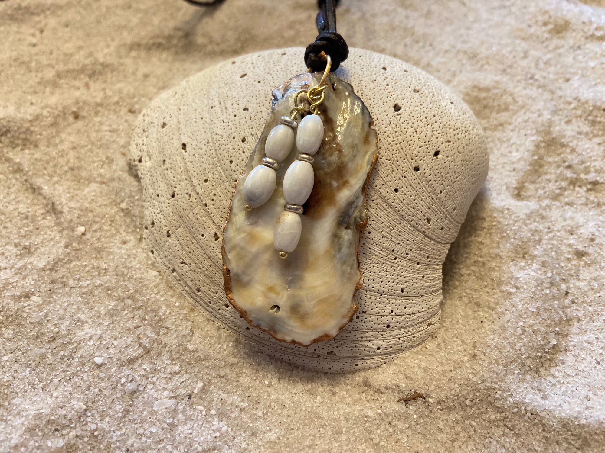 B. Light Necklace - Oyster Shell With Gold Leaf and Pearl Glass Beads on Brown Leather Cording