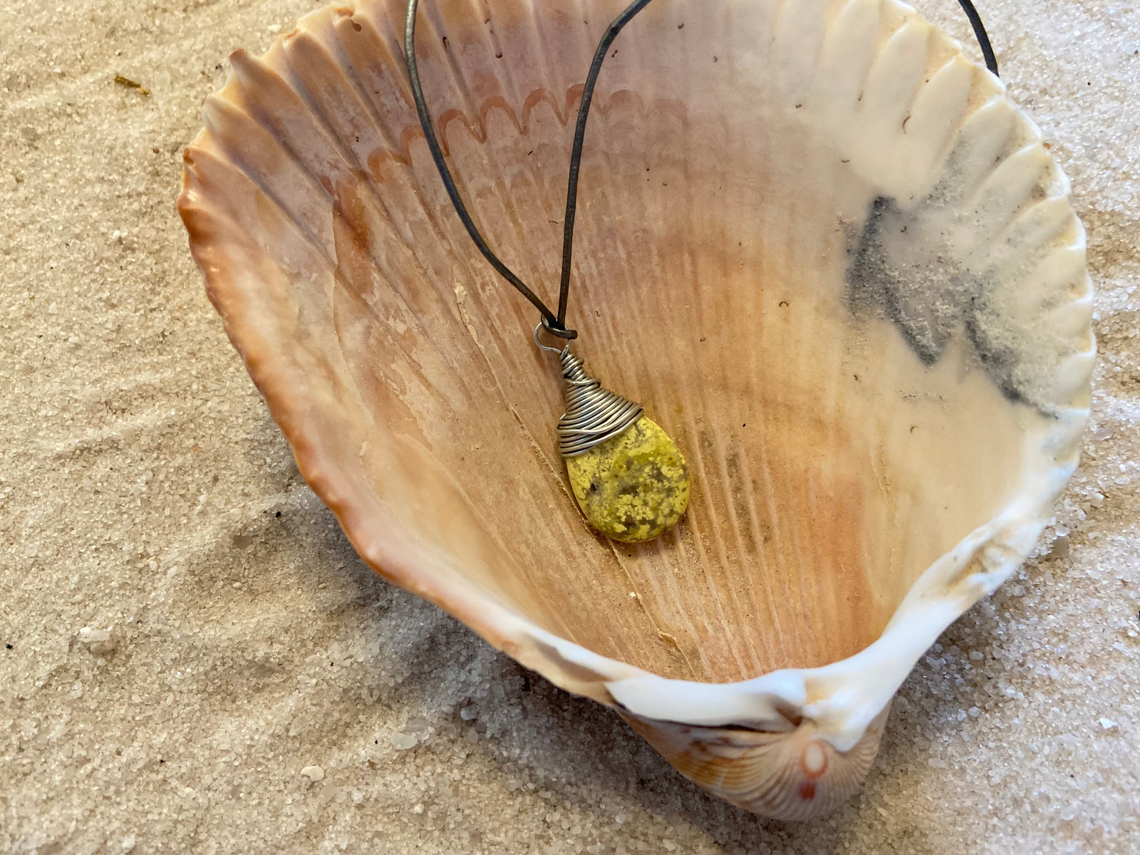 B. Light Necklace Polished Pale Yellow Stone wrapped in Silver Wire on Gray Leather Cord