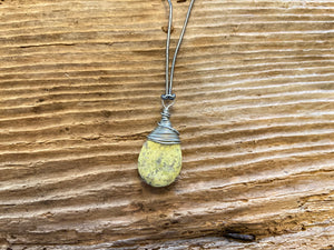 B. Light Necklace Polished Pale Yellow Stone wrapped in Silver Wire on Gray Leather Cord