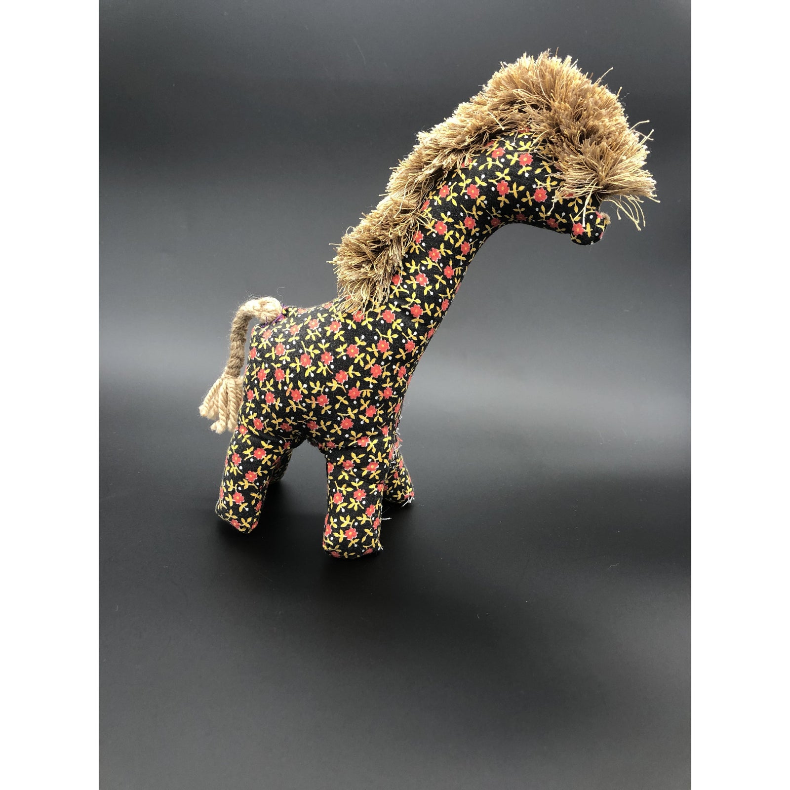 Giraffe black with red flowers