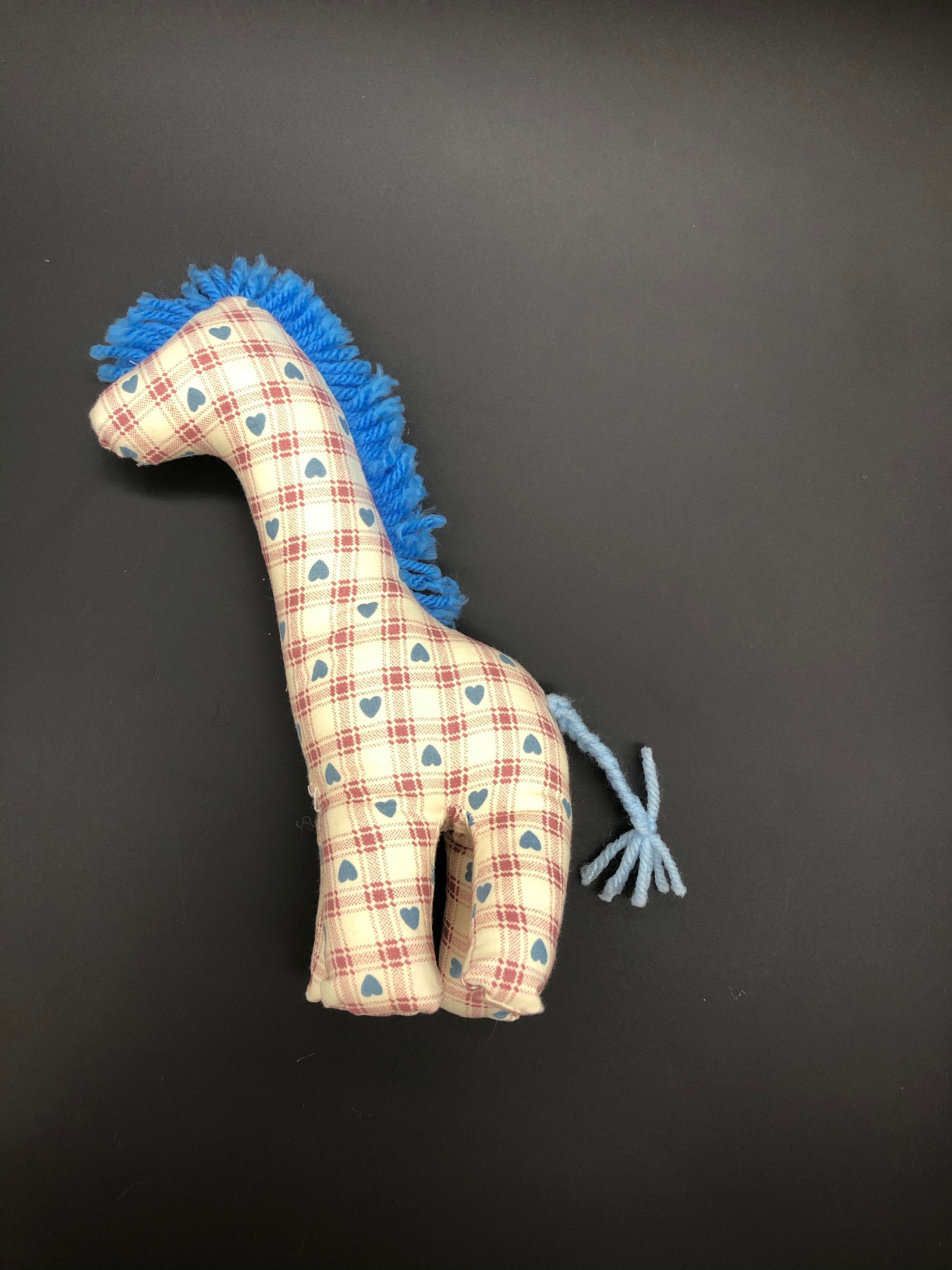 Giraffe with blue hearts and red plaid