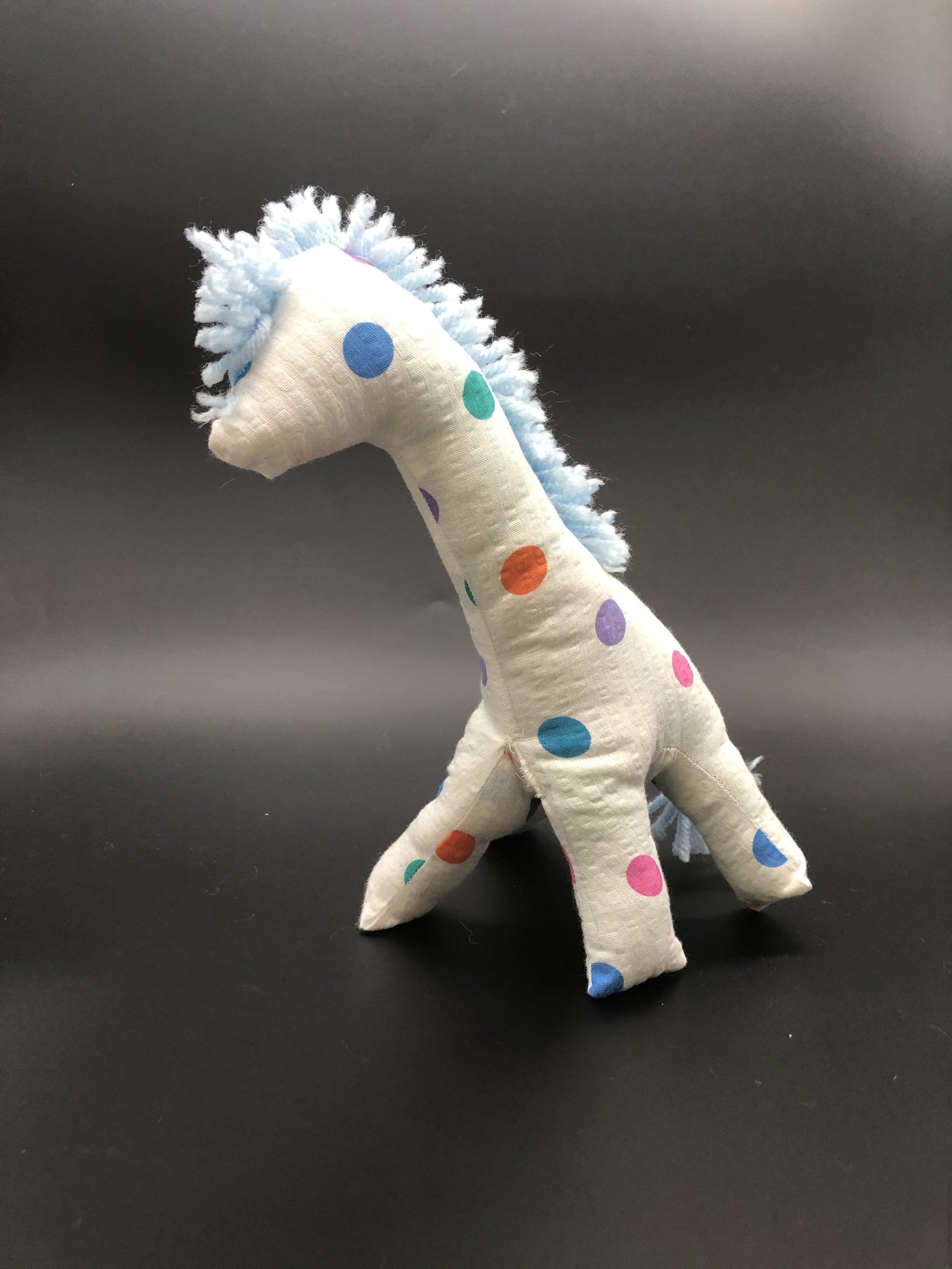 Giraffe white with multi-colored polka dots
