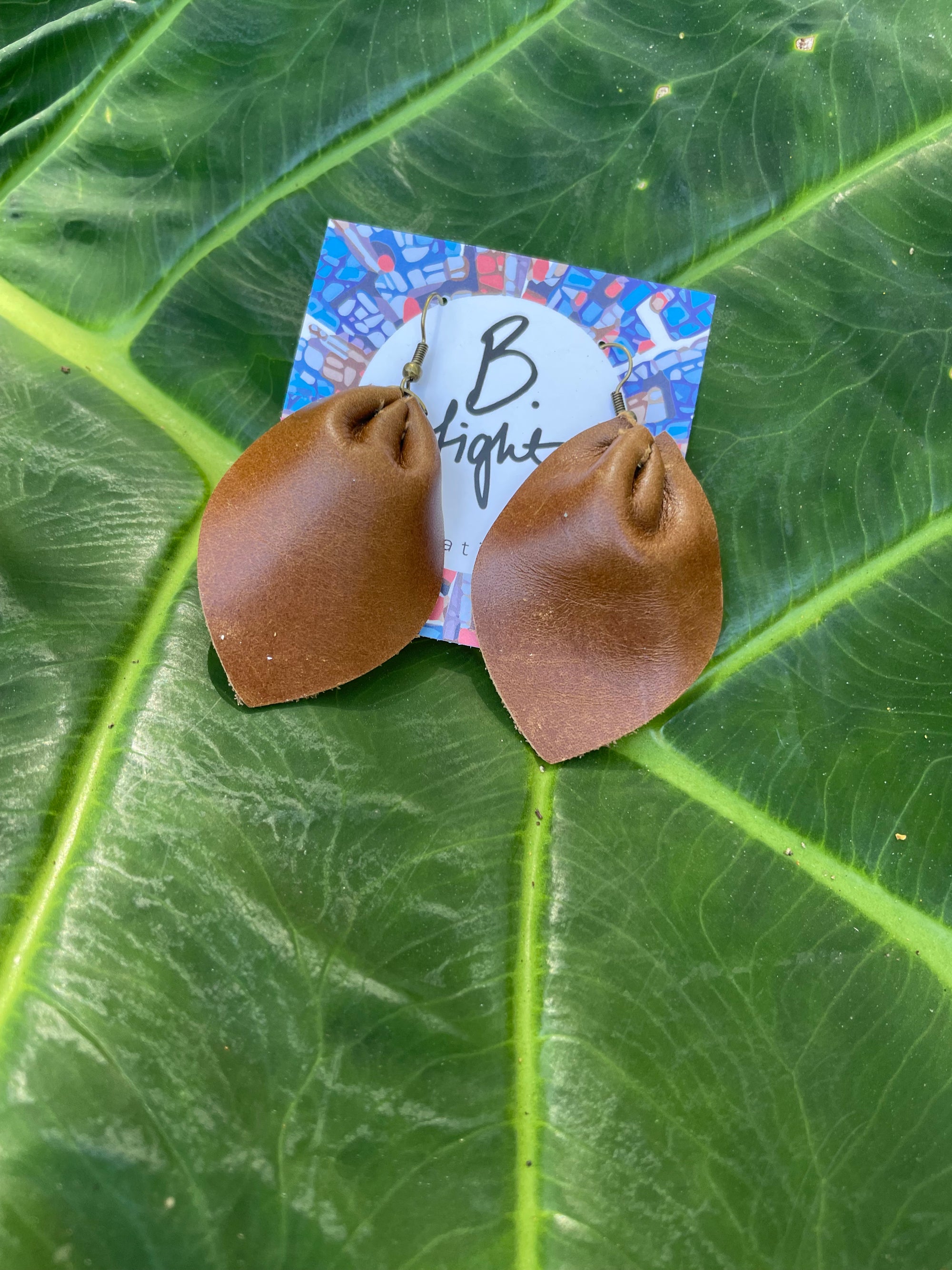 B. Light - Leaf shaped leather earring